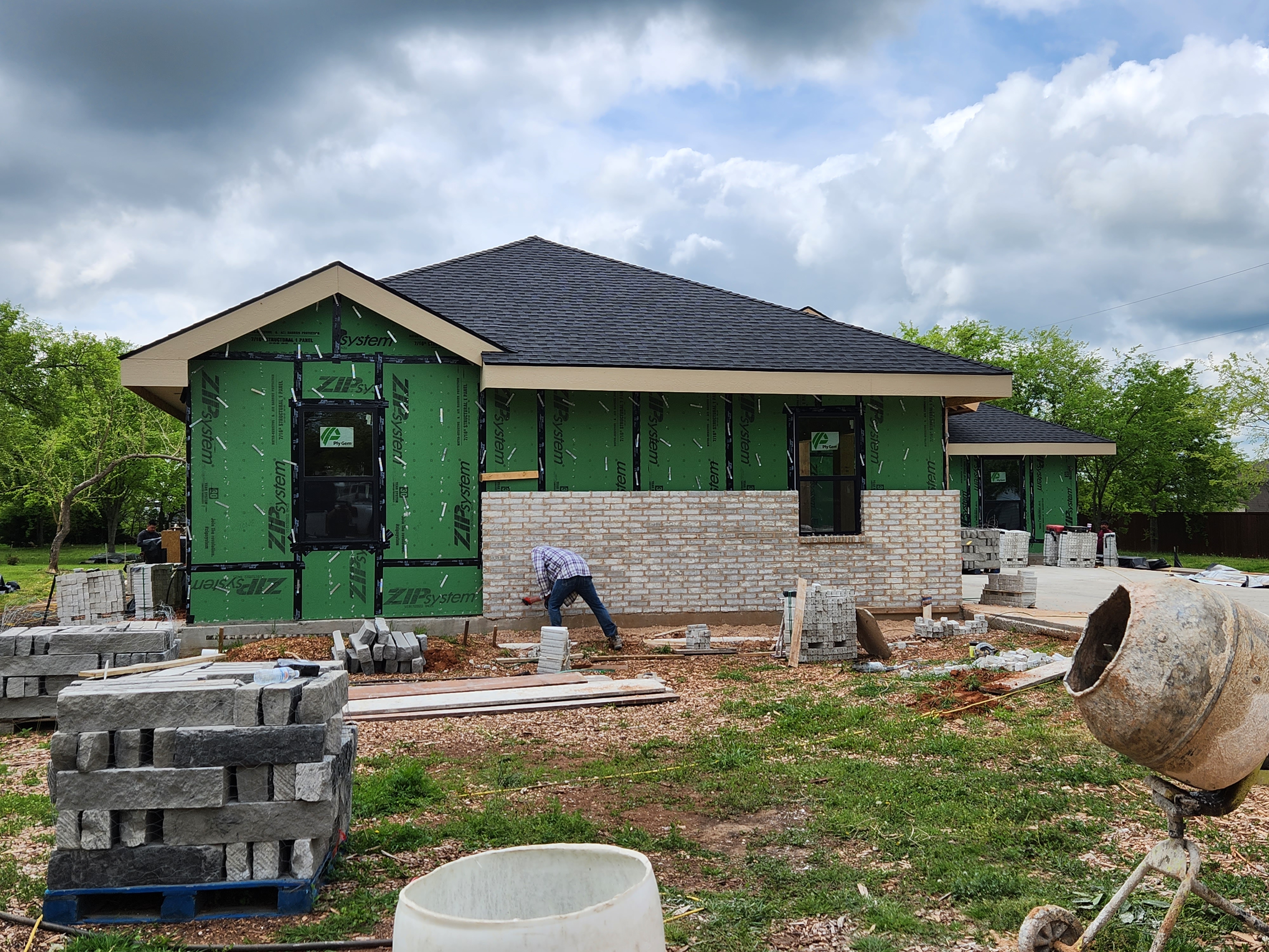 Exterior envelope and masonry underway — Nova Luxe Construction, Dallas–Fort Worth