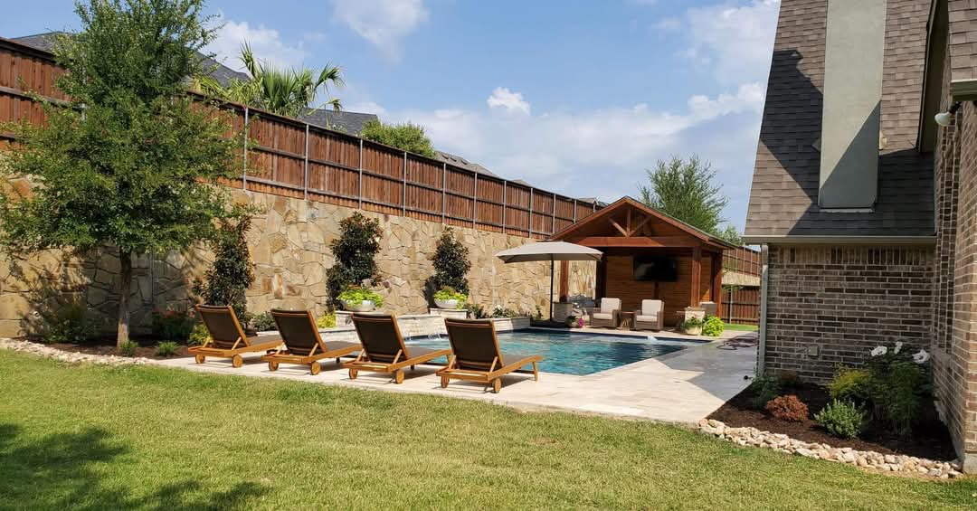 A refined Dallas–Fort Worth custom home at blue hour with warm interior lighting.